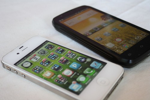 The Cloudfone Thrill 430x beside an iPhone 4s. (Photo by Marlen Limpag)