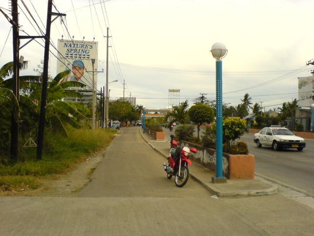 STAGGERING PRICE. This lamppost on a street in Mandaue City, Cebu costs P224,600 per unit. More than double the cost of the parked motorcycle and the bag that contains a laptop, digital camera, voice recorder, and various other digital accessories.