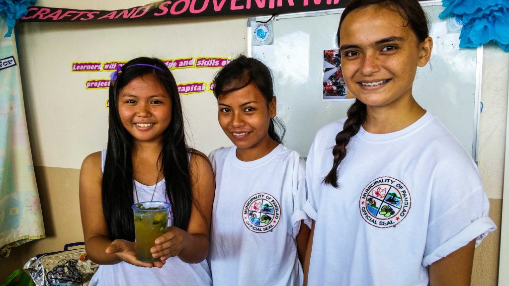 Sheila Marie Fraser, Evelyn Tangcawan and Elvie May Sangan prepare non-alcoholic drinks to demonstrate their hospitality 101 training.